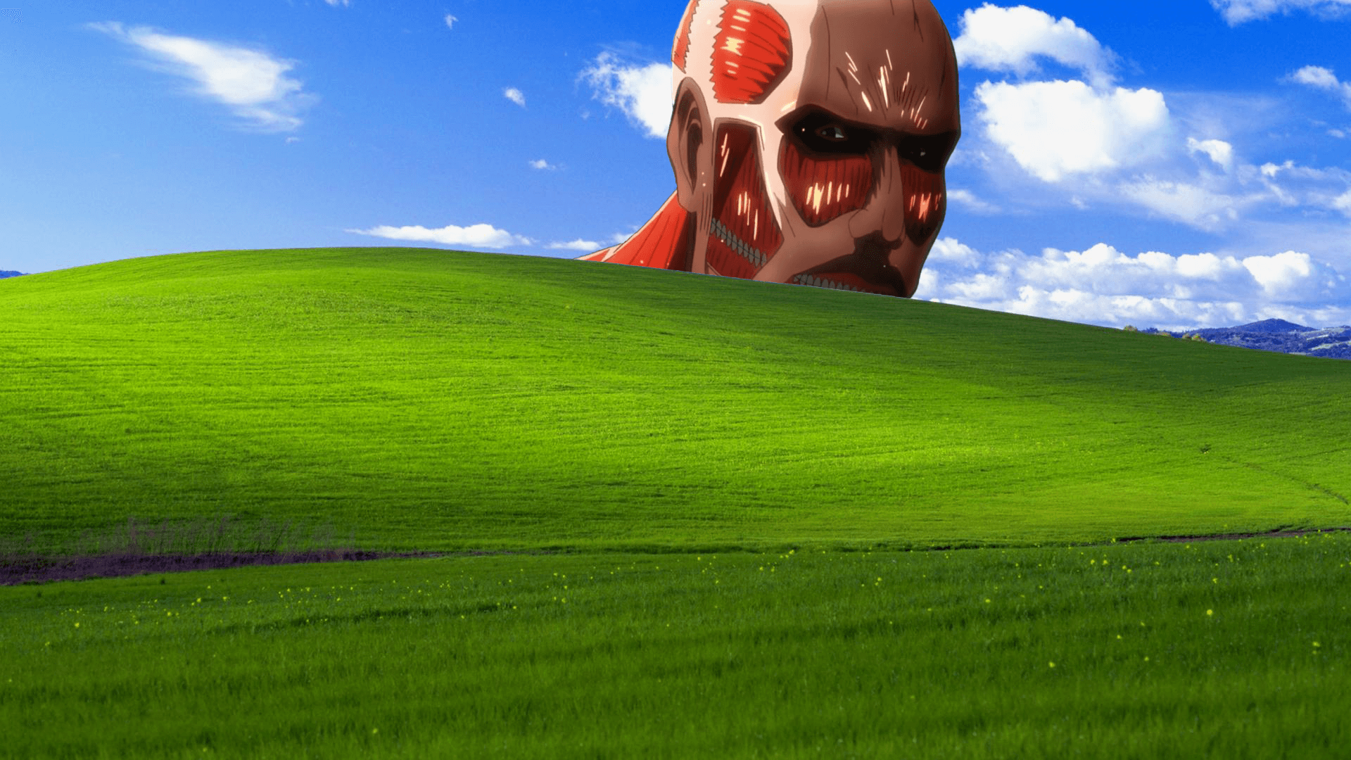 El Titán Colosal apareciendo tras la colina de fondo de Windows XP